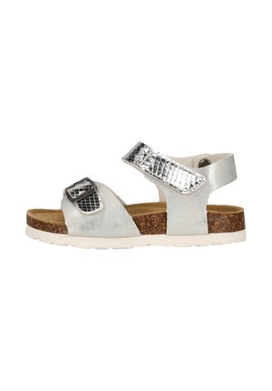 Silver open-toe sandal with adjustable straps, a cork footbed, and a white textured sole.