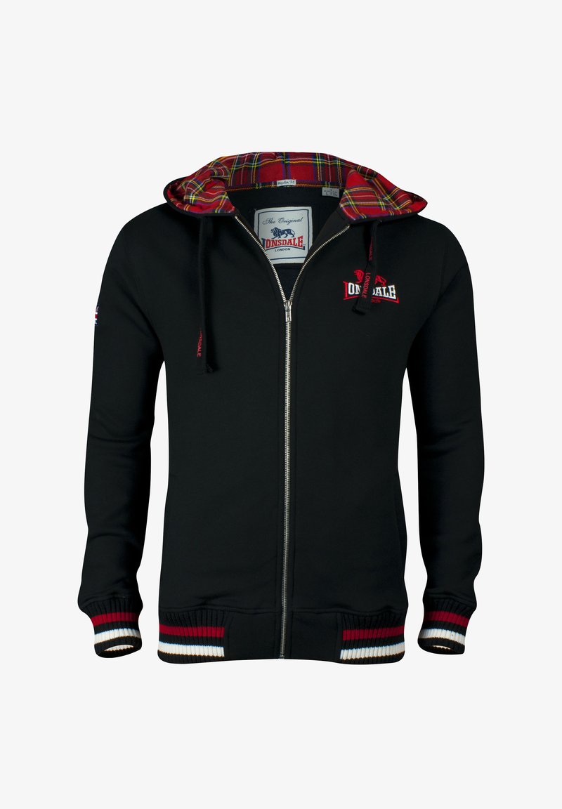 Hanorac negru cu fermoar, cu căptușeală roșie și cu carouri la glugă, având mansete și tiv din tricot, cu dungi roșii, albe și maro; logo pe piept.