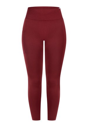 Røde leggings med en høj, ribstrikket linning. Fremstillet af et glat, elastisk materiale med en sidelomme for praktikalitet.