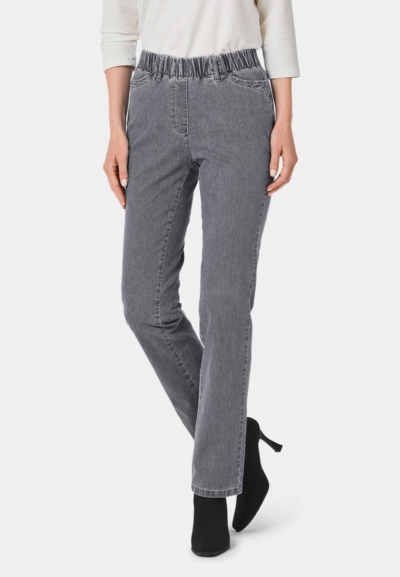 Grijze pull-on broeken met een elastische tailleband, voorzien van een subtiele verticale textuur en zijzakken. Draag ze met zwarte enkellaarsjes.