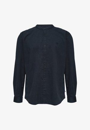 Tumed sinine nööbiga pluus, mandariinikaelusega, pikkade varrukatega ja veidi kõverate servadega. Valmistatud pehmest, tekstuurilisest kangast.