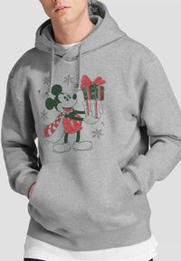 Gray hoodie featuring a vintage-style illustration of Mickey Mouse holding a gift, with green and red accents and snowflake details.