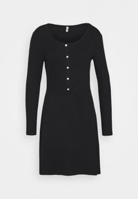 Svart långärmad klänning i mjukt tyg, med rund halsringning och fem dekorativa vita knappar fram, i en figurnära silhuett.