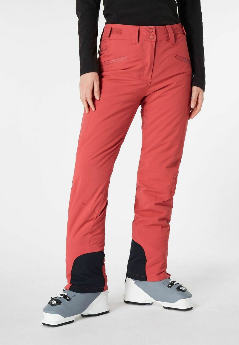 Pantaloni da sci rosa con una vestibilità su misura, realizzati in materiale elasticizzato e impermeabile; presentano dettagli neri e tasche con zip per riporre gli oggetti.