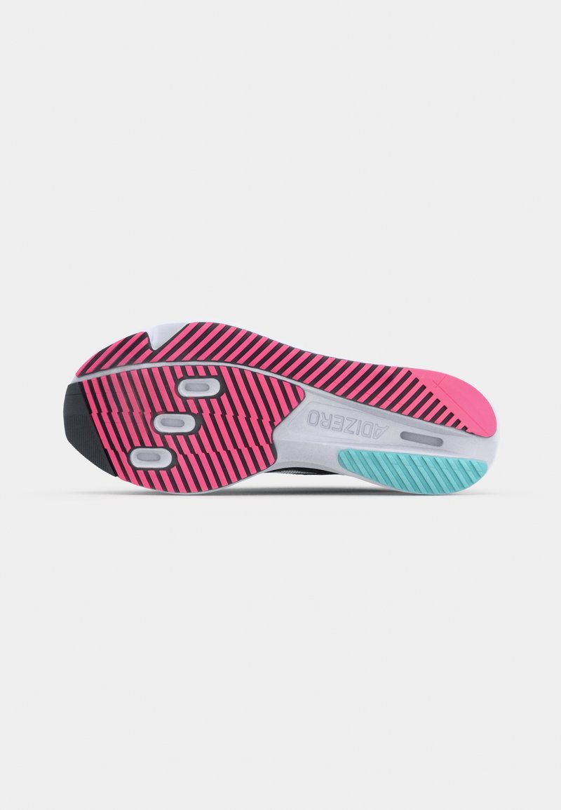 Suela de zapato con un patrón de rayas negras y rosas, media suela gris y acentos en azul claro. Forma redondeada con indentaciones circulares para mayor agarre.