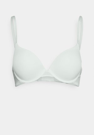 Senza imbottitura, reggiseno bianco con tessuto liscio, coppe triangolari, spalline regolabili e ganci sul retro per la chiusura. Nessun ulteriore decoro.