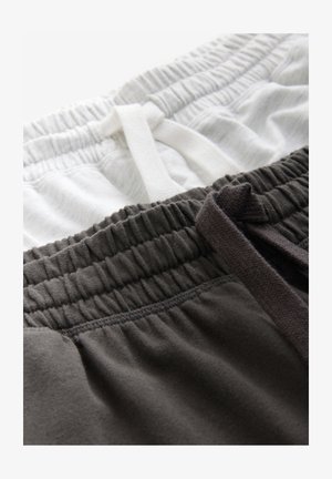 Two pairs of elastic waistband shorts in light gray and dark gray cotton, featuring drawstrings and a soft, textured finish.