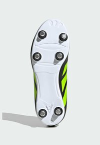 Sole di scarpini da calcio neri e verde neon con una piastra bianca caratterizzata da quattro tacchetti circolari e una superficie texturizzata, progettata per la trazione.