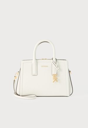 White structured handbag with double handles, gold "MK" charm, and detachable shoulder strap on a plain background.
