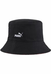Chapeau seau noir en tissu, avec un dessus plat et une large bordure inclinée vers le bas. Logo Puma blanc brodé à l'avant.