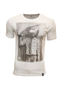 White cotton t-shirt featuring a black-and-white graphic print of a person with a globe for a head, holding a gas nozzle.
