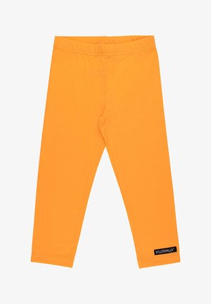 Hellorange Kinderleggings mit elastischem Bund und kleinem schwarzem Villervalla-Label am unteren Bein.