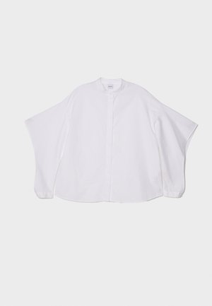 Camicia bianca con colletto rotondo, maniche ampie e orlo dritto. Realizzata in un leggero e morbido tessuto di cotone.