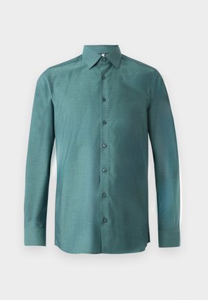 Tumesinise riidega pikkade varrukatega särk, millel on tekstureeritud kudum, nööbiga eesmine osa, terav krae ja sobitatud nööbid. Kerge joonisega disain.