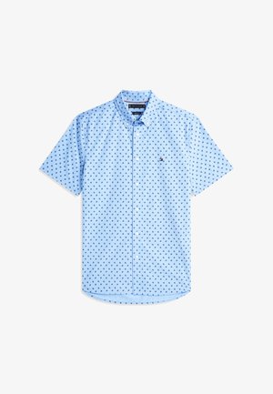 Chemise bleu clair à manches courtes avec un petit motif d'ancre bleu foncé et un logo Tommy Hilfiger sur la poitrine gauche.