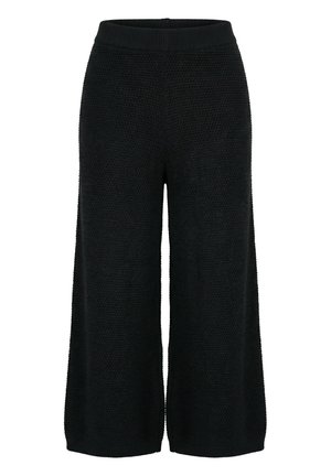 Pantaloni neri a gamba larga a coste corte con vita elastica e orlo a coste su sfondo bianco.