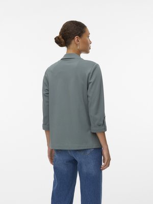 Gray, loose-fitting jacket with a collar and rolled sleeves, made of soft fabric. The back features a clean design with no embellishments.