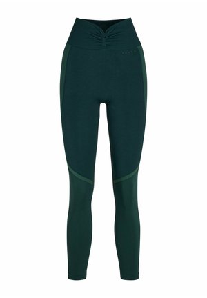 Donkergroene legging met hoge taille, geplooide voorkant en contrasterende zijpanelen. Gemaakt van een rekbare stof voor comfort en bewegingsvrijheid.