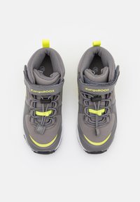 Gray KangaROOS shoes with a high-top design, featuring bright yellow accents, laces, and a padded collar for comfort. Rubber outsole visible.