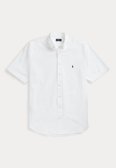 White short-sleeve button-up shirt made of cotton, featuring a classic collar and a small navy logo on the left chest.