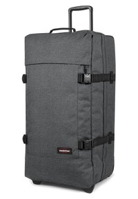 Bolsa de viaje de tela gris con un mango retráctil, cierres laterales y una base resistente. Cuenta con un amplio compartimento principal para almacenamiento.