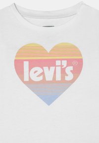 Levi's® SHORT SLEEVE WITH FLUTTER - T-shirt estampada - pineapple slice