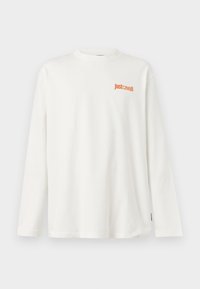 Λευκό μακρυμάνικο πουκάμισο με λογότυπο "Just Cavalli" σε πορτοκαλί χρώμα στο αριστερό μέρος του στήθους, απεικονισμένο σε απλό φόντο.