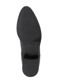 Semelle de chaussure en cuir noir avec une surface lisse, une adhérence texturée et un léger talon. Présente une finition mate et un design de motif distinctif.