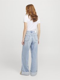 Light blue high-waisted jeans with a relaxed fit, wide legs, and cuffed hems. Back pockets are visible on each side.