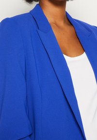 Marks & Spencer Kort kappa / rock - blue