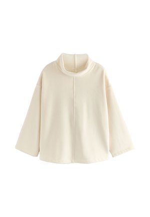 Suéter color crema con cuello alto, mangas anchas y textura acanalada. Presenta una costura central y un corte relajado.