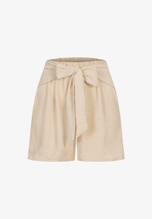 Beige shorts dengan kain tekstur, dilengkapi dengan pinggang elastis dan detail ikat di bagian depan. Desain longgar, panjang hingga lutut.