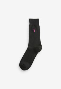 Chaussette en coton noir avec bord-côte, dotée d'un petit logo de homard rose au-dessus de la cheville. Texture lisse et forme classique pour le confort.