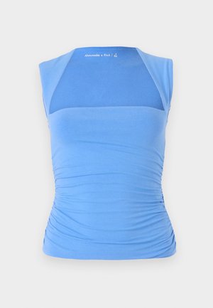 Blå, ermeløs topp laget av elastisk stoff med rynkede sider for tekstur. Har et mesh-panel på forsiden, glatt halslinning og logodetalj.