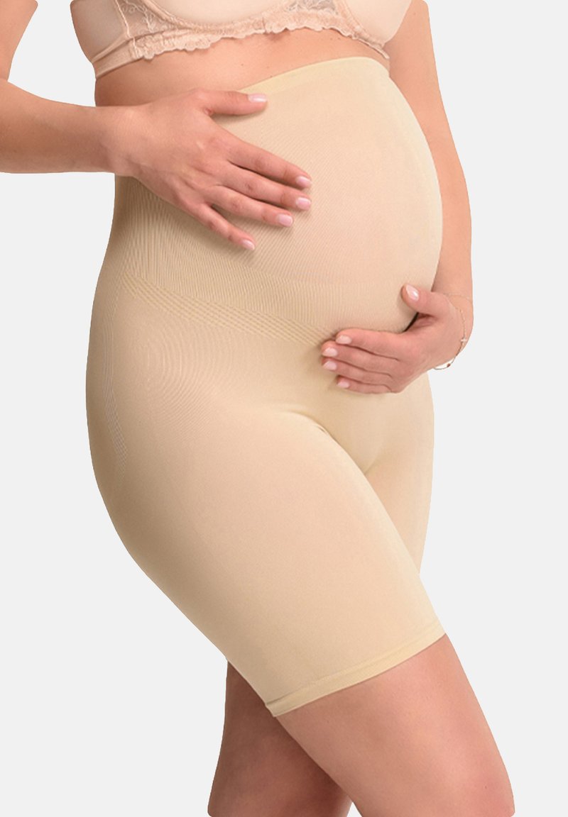 Pantaloni maternità beige, realizzati in tessuto elasticizzato e morbido. Il design a vita alta offre sostegno, con una sottile texture a coste.