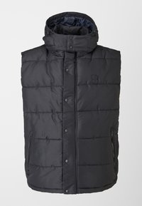 Veste matelassée noire sans manches avec col montant, boutons-pression sur le devant, poches latérales zippées et logo discret sur la poitrine.