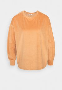 Sweat-shirt en velours côtelé de couleur orange doux, avec manches longues, encolure ronde et texture côtelée verticale pour plus de détails.