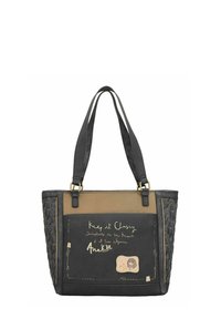 Zwarte en bruine tote bag met dubbele handvatten, decoratieve handschrift en een klein naaipatch met een illustratie van een meisje.