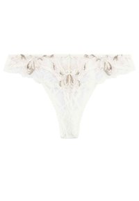 String en dentelle ivoire avec broderie florale en doré. Présente des panneaux en tulle transparent et des bords festonnés, conservant un design délicat et complexe.