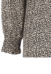 Bluzka z długim rękawem w czarno-kremowy kwiatowy wzór, z marszczonymi mankietami i miękkim, teksturowanym materiałem. Ozdobiona drobnymi wzorami liści.