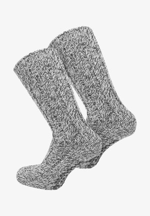 Graue gestrickte Socken mit strukturiertem Rippmuster und einer Nahtdetails an der Zehe, in einem gemütlichen Design bis zur Mitte der Wade.