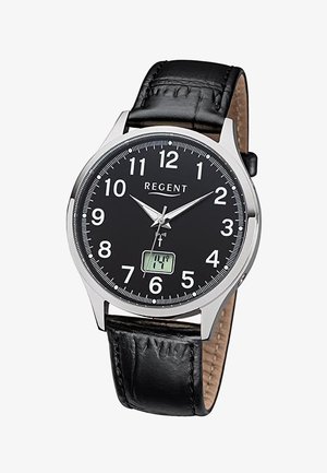 Montre analogique avec bracelet en cuir noir, cadran noir, chiffres blancs, boîtier argenté et petit affichage numérique de la date à 6 heures.