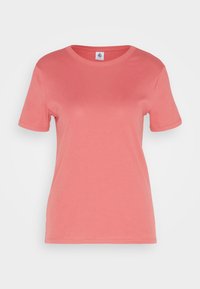 Korallrosa kortärmad t-shirt i mjuk bomull. Har rund halsringning och en slät yta. Inga grafik eller mönster.