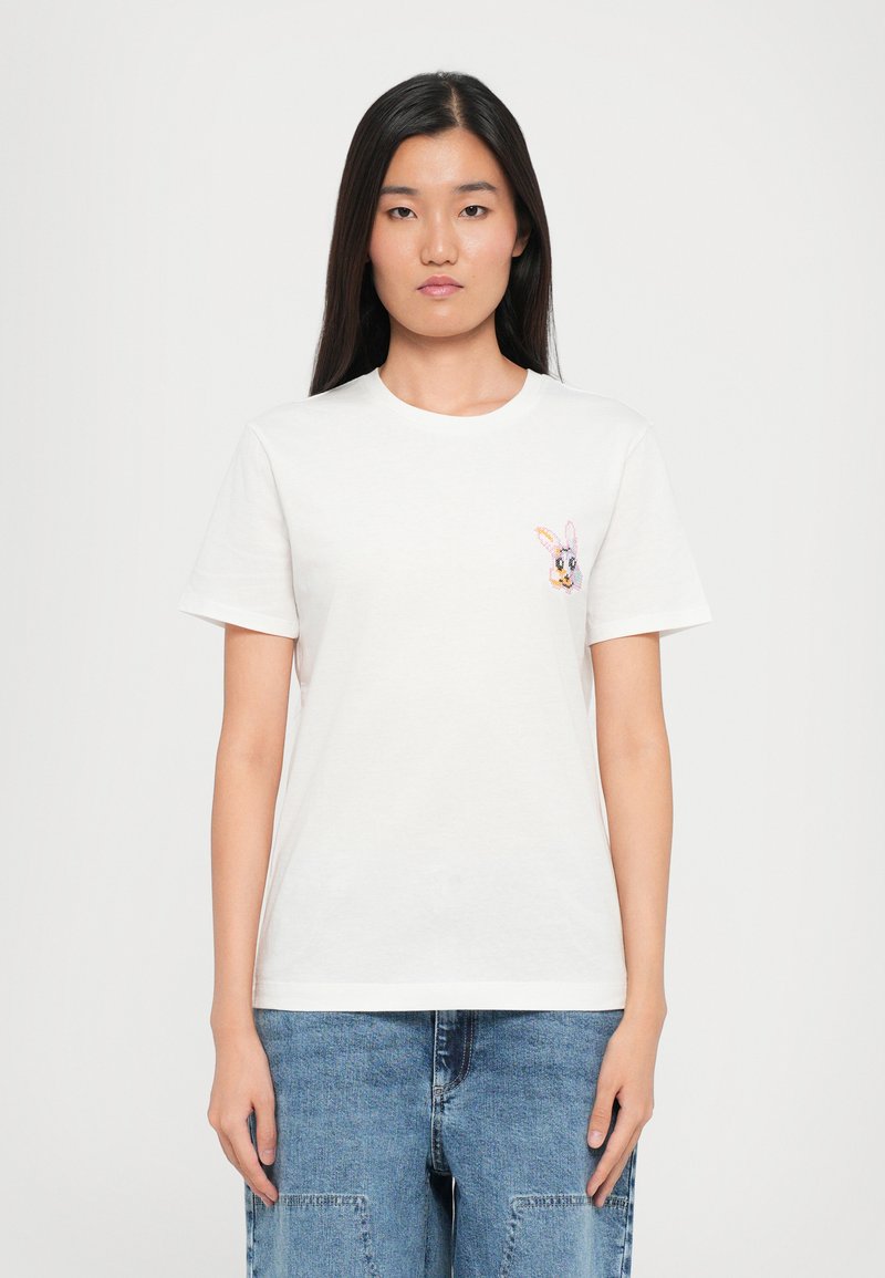 White cotton t-shirt with short sleeves, round neckline, and a small, colorful embroidered bunny detail on the left chest.