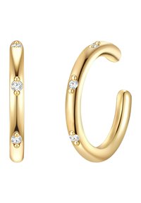 Guldörhängen med en slät yta, som har tre små klara stenar inlagda i designen, vilket ger en elegant, böjd form.