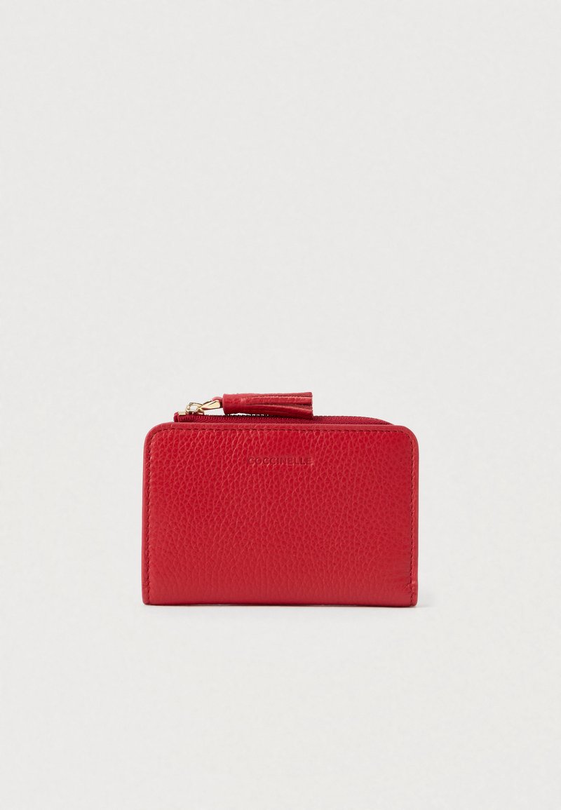 Red textured leather wallet with a gold zipper and matching tassel pull tab, compact rectangular shape on a plain background.