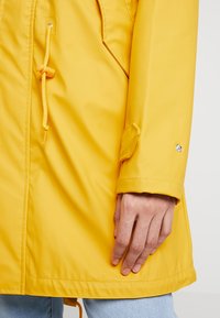 Derbe TRAVEL FRIESE LIFESAVER - Parka - yellow