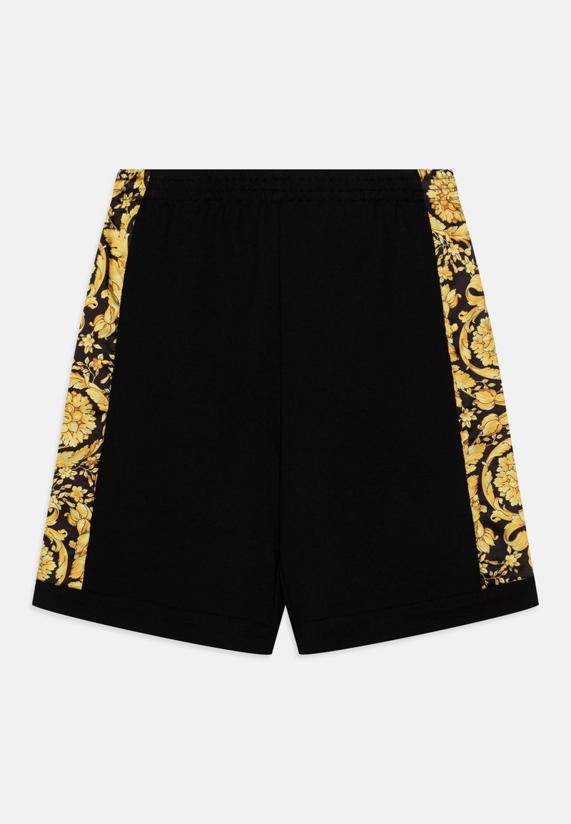 Shorts noirs avec ceinture élastique, présentant de larges bandes dorées à motifs floraux le long des deux côtés.