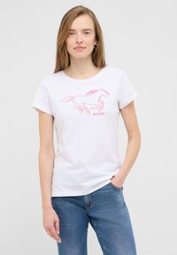 White cotton t-shirt featuring a pink outline graphic of a running horse and the word "MUSTANG" below. Short sleeves and round neck design.