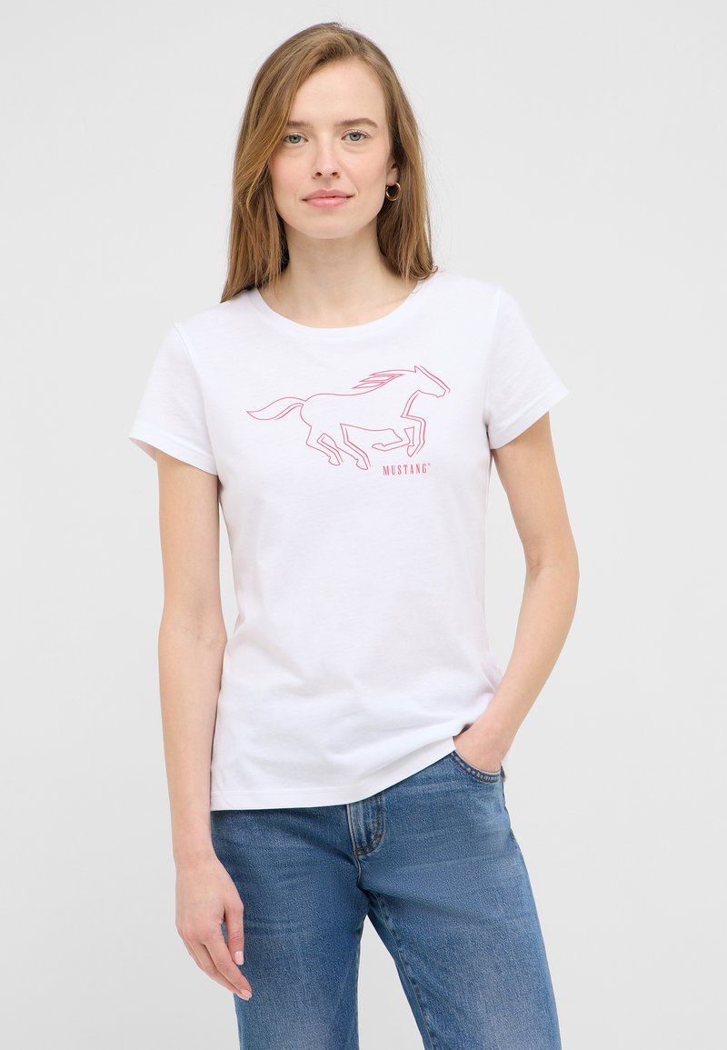White cotton t-shirt featuring a pink outline graphic of a running horse and the word "MUSTANG" below. Short sleeves and round neck design.